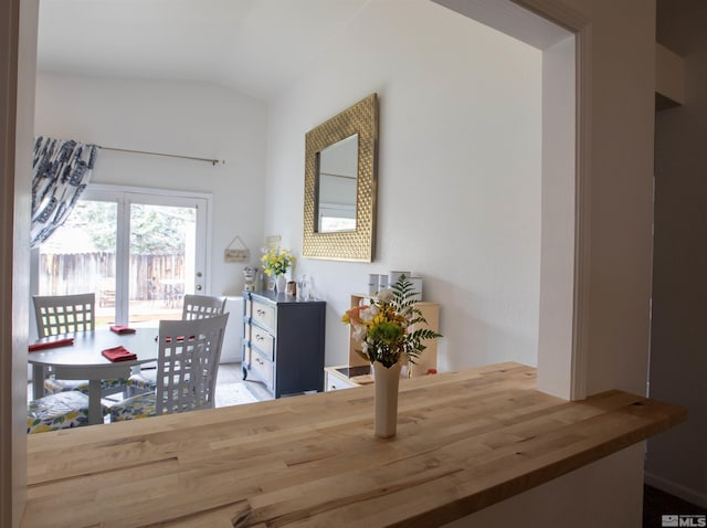 dining space with lofted ceiling