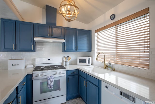 kitchen featuring blue cabinetry, sink, tasteful backsplash, pendant lighting, and white appliances