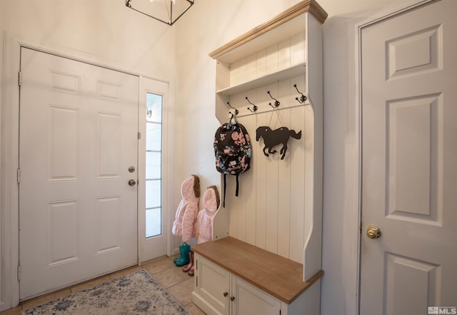 mudroom featuring a healthy amount of sunlight and light tile patterned flooring