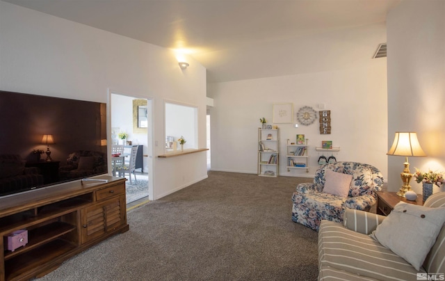 carpeted living room with lofted ceiling