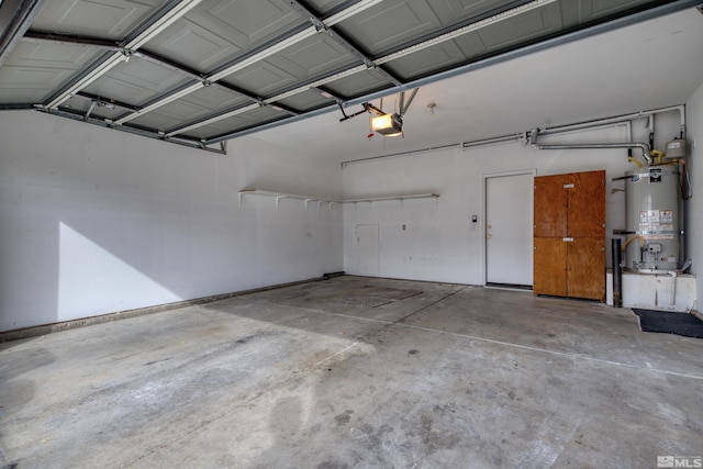 garage featuring water heater and a garage door opener