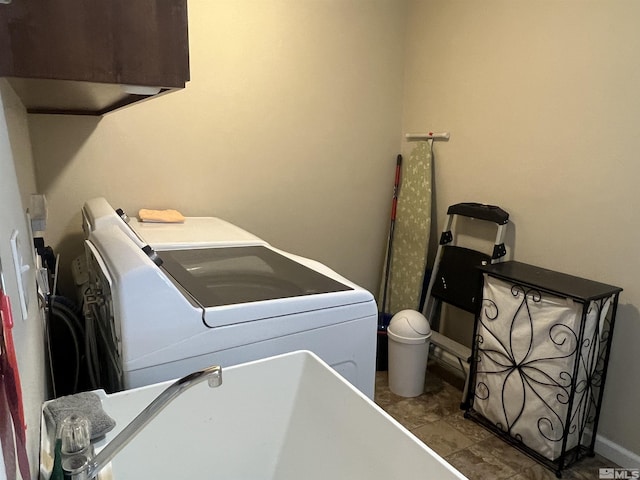 washroom with cabinets and separate washer and dryer