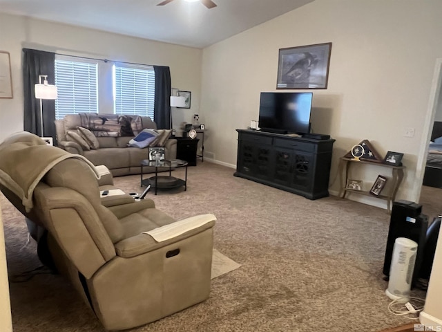 living room featuring vaulted ceiling, ceiling fan, and carpet flooring