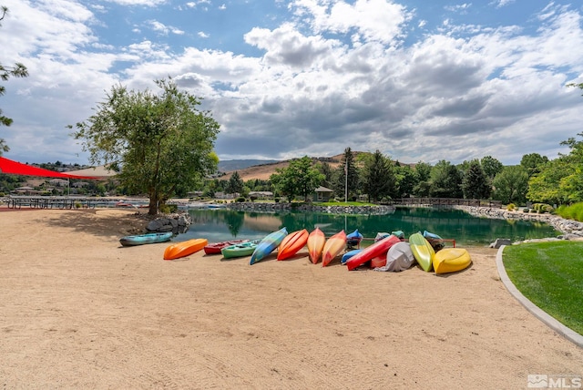 surrounding community with a water view