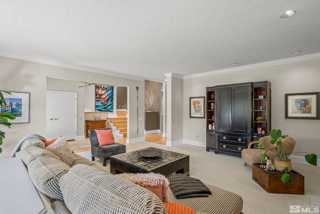 living room featuring crown molding, light colored carpet, and a textured ceiling