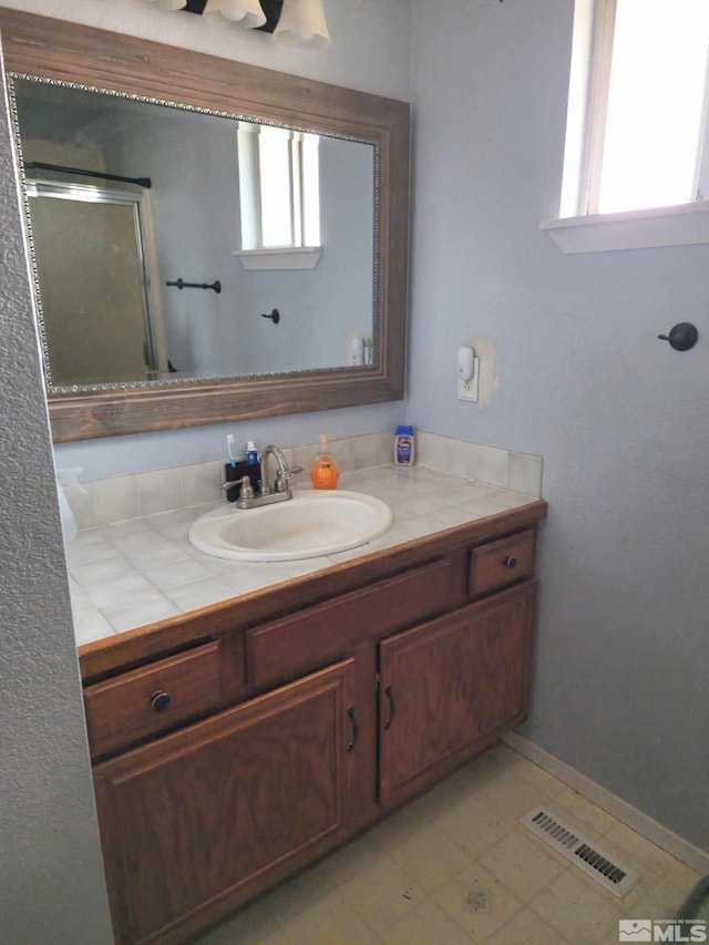 bathroom featuring vanity and plenty of natural light