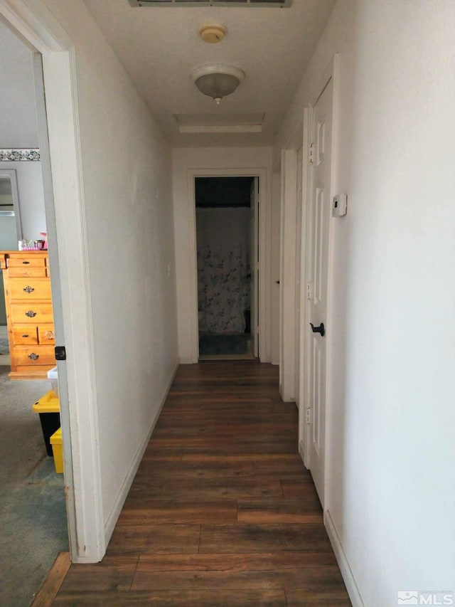 hall with dark hardwood / wood-style floors