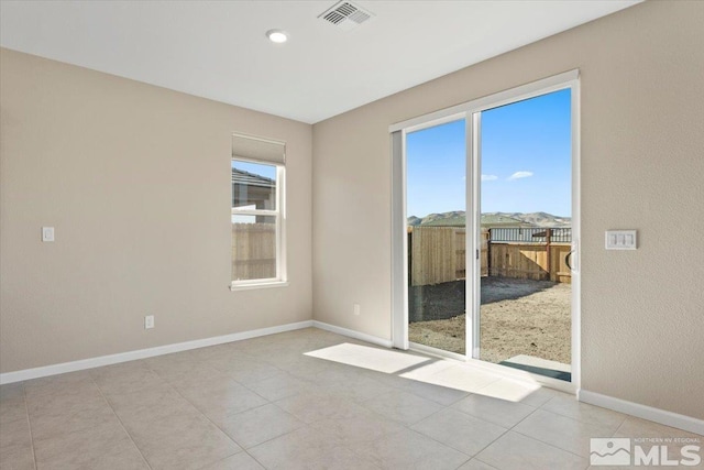 view of tiled spare room