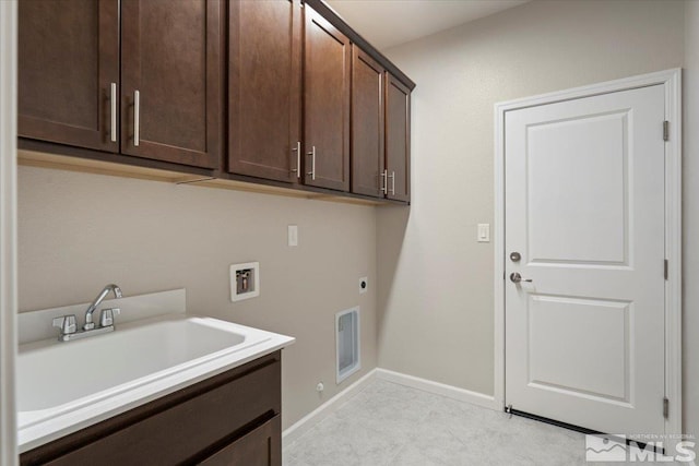 laundry room with cabinets, sink, hookup for a washing machine, and electric dryer hookup