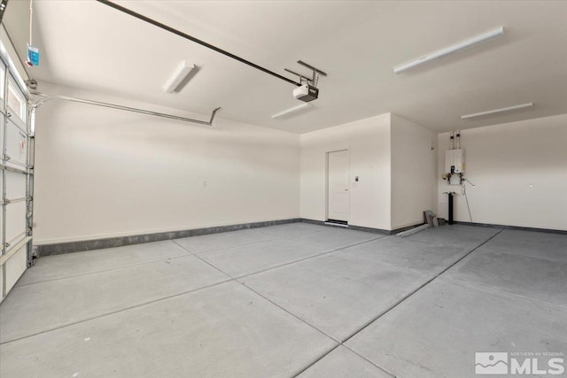 garage featuring a garage door opener and water heater