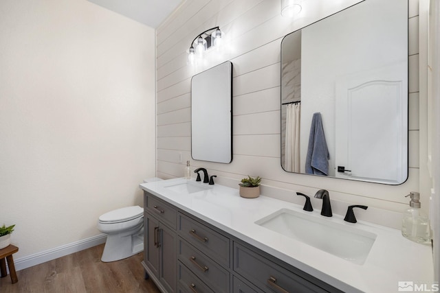 bathroom with vanity, hardwood / wood-style floors, and toilet