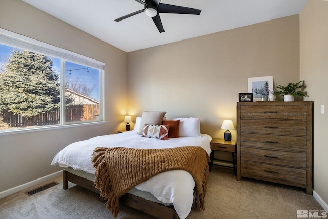 bedroom with light colored carpet and ceiling fan