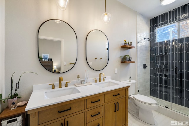 bathroom featuring vanity, an enclosed shower, and toilet