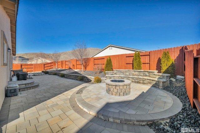 view of patio with an outdoor fire pit