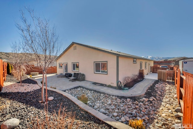 back of house with a patio