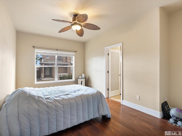 bedroom featuring ceiling fan and dark hardwood / wood-style flooring