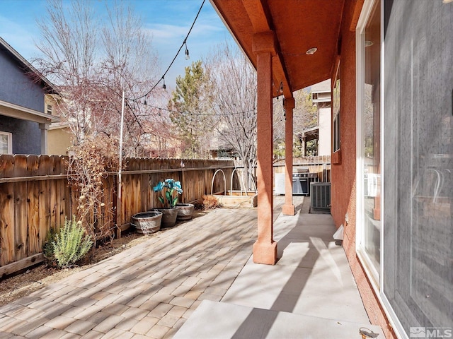 wooden terrace with a patio