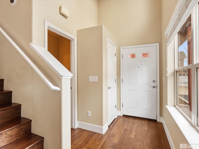 entryway with hardwood / wood-style flooring