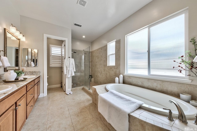 full bathroom with tile patterned flooring, vanity, independent shower and bath, and toilet