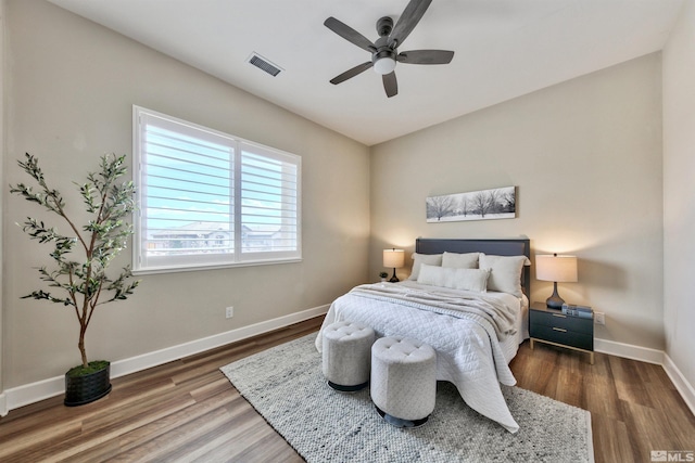 bedroom featuring hardwood / wood-style floors and ceiling fan