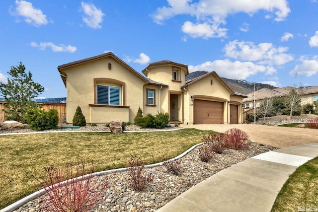 view of front of home with a garage and a front yard