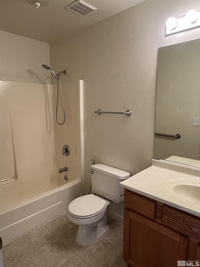 full bathroom featuring tile patterned floors, vanity, toilet, and tub / shower combination