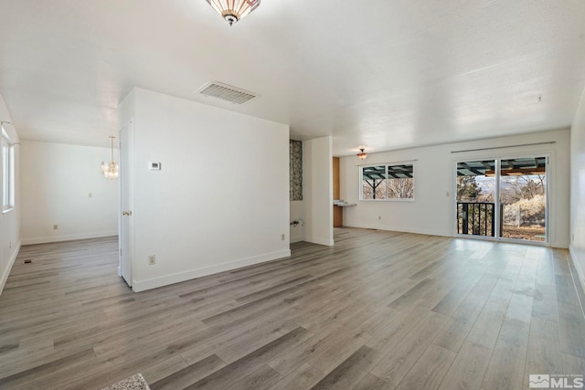 unfurnished living room featuring light hardwood / wood-style flooring