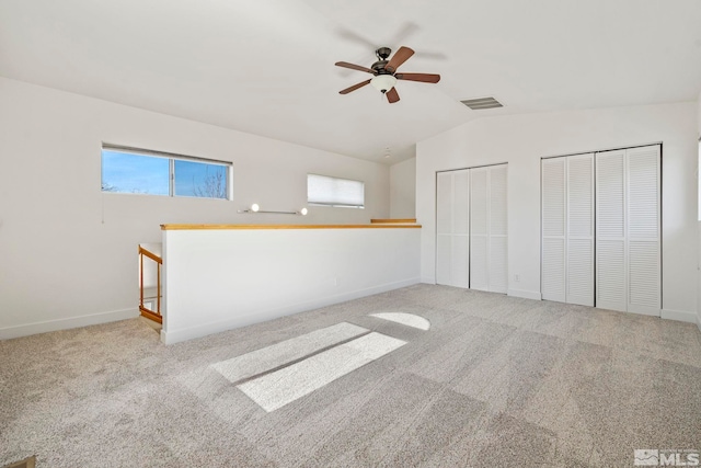 interior space featuring ceiling fan and lofted ceiling