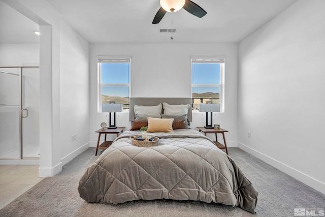 bedroom with baseboards, multiple windows, visible vents, and carpet flooring