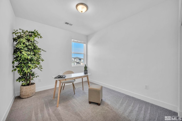 office area with carpet floors, visible vents, and baseboards