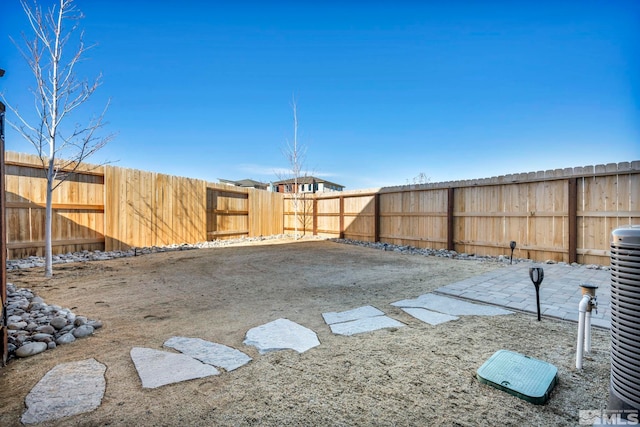 view of yard with a fenced backyard