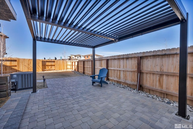 view of patio with a fenced backyard and cooling unit