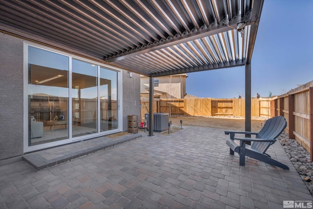 view of patio with central AC unit, fence, and a pergola