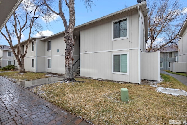 view of home's exterior with a yard