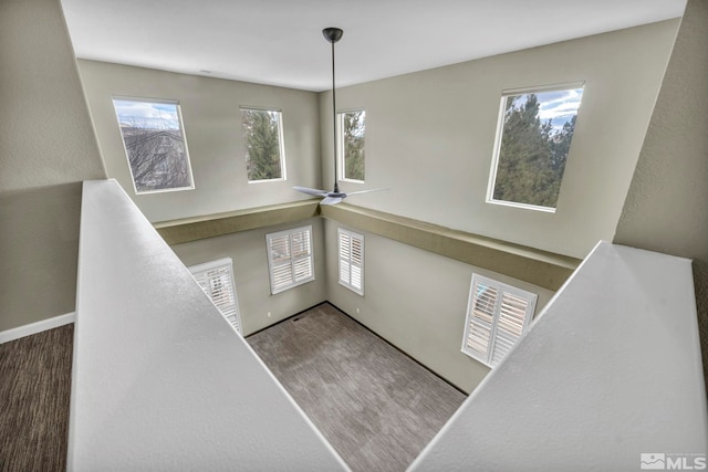 foyer entrance featuring ceiling fan