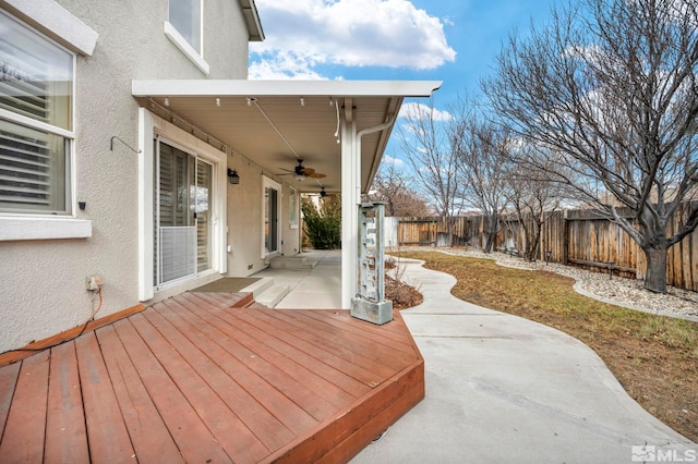 exterior space with ceiling fan and a patio