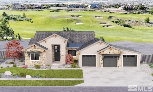 view of front of home with a garage and a front lawn