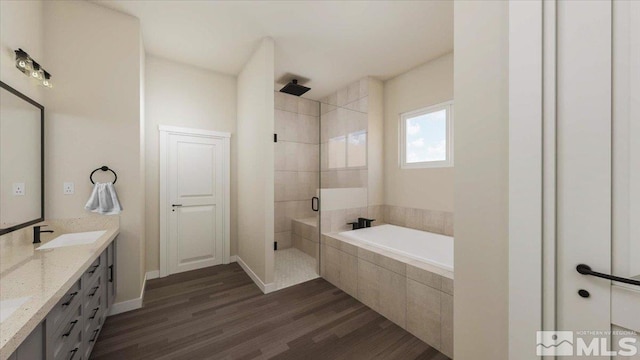 bathroom with hardwood / wood-style flooring, vanity, and separate shower and tub