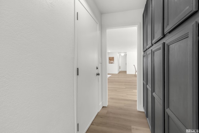 hallway with light wood-type flooring