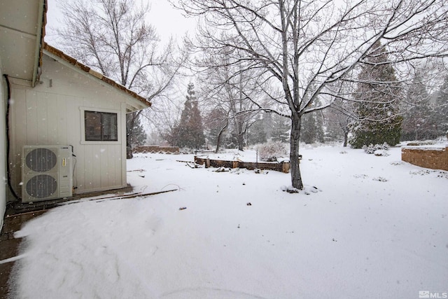 yard layered in snow with ac unit