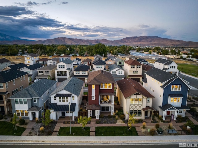 birds eye view of property featuring a mountain view