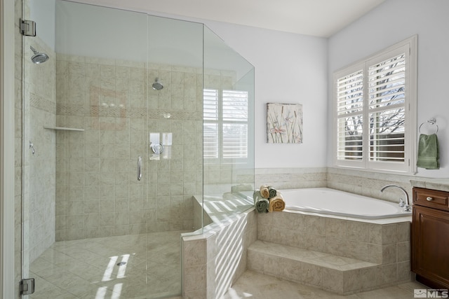 bathroom featuring vanity and plus walk in shower