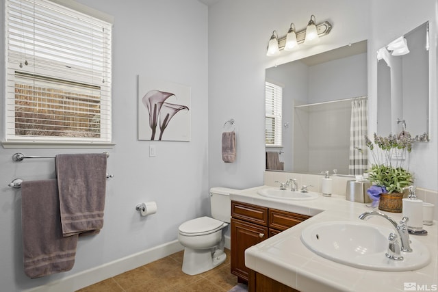 bathroom featuring a shower with curtain, tile patterned floors, toilet, and vanity