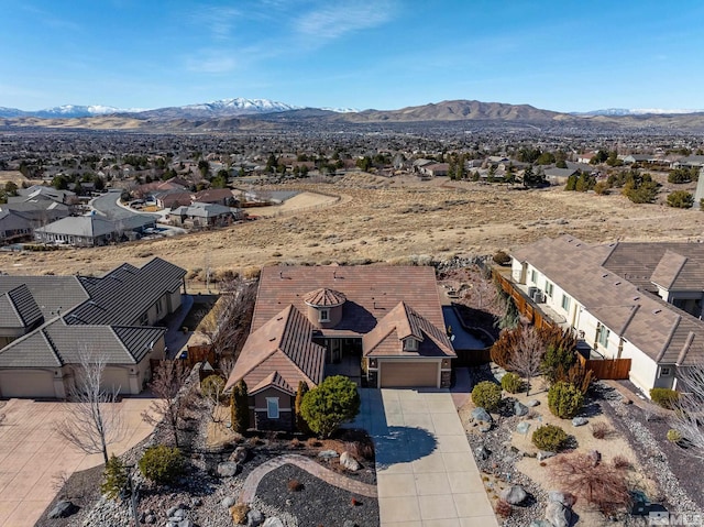 birds eye view of property with a mountain view