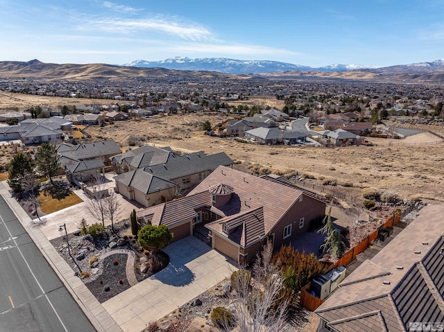 birds eye view of property featuring a mountain view