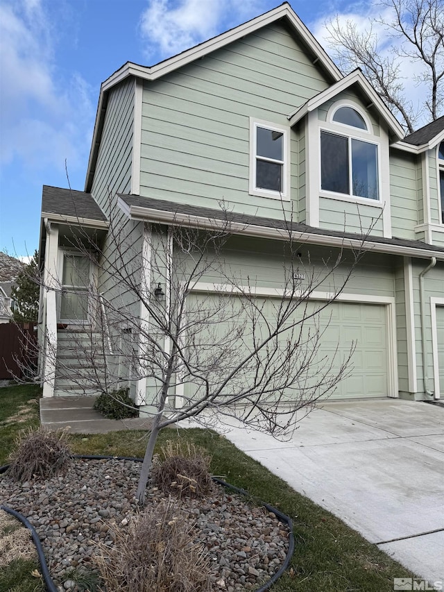 view of side of property with a garage