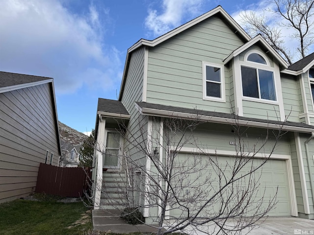 view of front of property with a garage