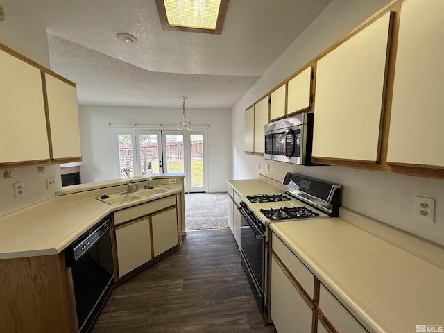 kitchen with sink, dishwasher, gas stove, a textured ceiling, and dark hardwood / wood-style flooring