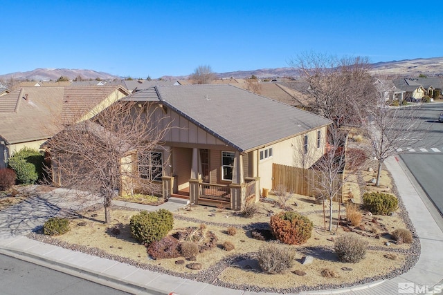 view of front of property featuring a porch and a mountain view