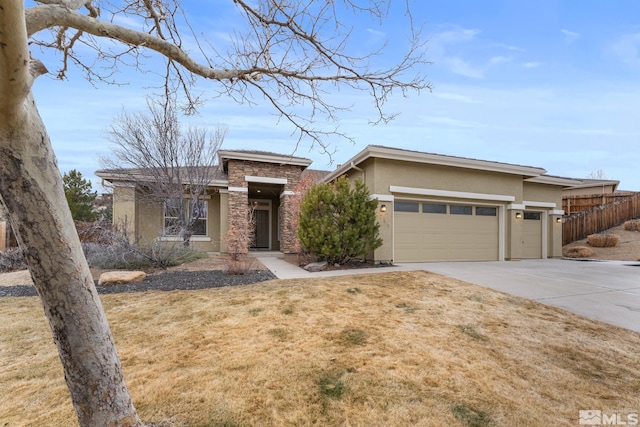 view of front of house featuring a garage and a front yard